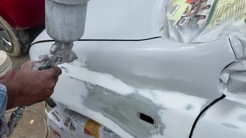 Application of first layer spray painting of the car fender. Stock Footage 160987052