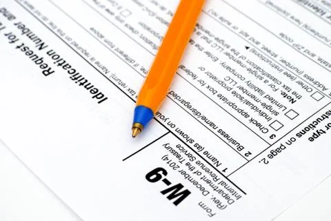 Application form W9 with pen Stock Photos
