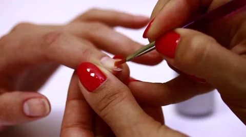 Application of the gel coating to the nails Stock Footage 50804903