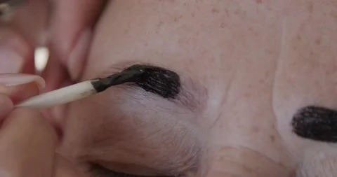 Application of henna on eyebrows,one eye front view Video stock 132969433