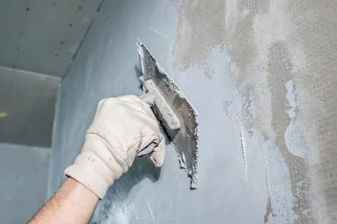 Application of insulation to the wall against moisture and water Stock Photos