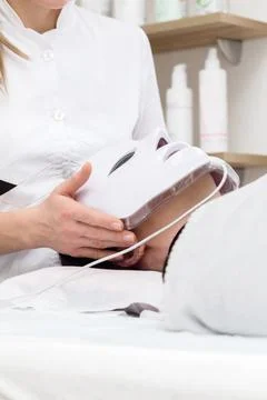 Application of LED Light Therapy Mask in Beauty Clinic Stock Photos