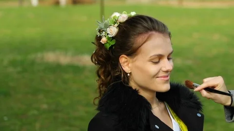 Application make up on bride before stylist wedding during sunny day Video stock 107660825