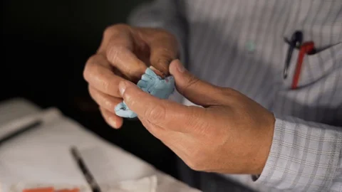 Application of modelling wax to the cast of RPD in 4k performed by an Stock Footage 107753197