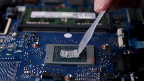 Application of a new thermal paste to the laptop processor. Close-up of the Stock Footage 316088067