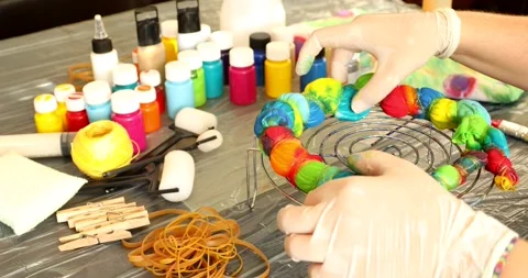 Application of paint in the style of tie dye 3 Stock Footage 131681338