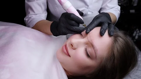 Application of pigment for permanent eyebrow makeup Stock Footage 266399825