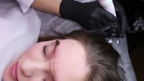 Application of pigment for permanent eyebrow makeup Stock Footage 266401341