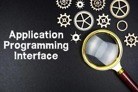 Application Programming Interface text message with magnifying glass on bla.. Stockfoto's