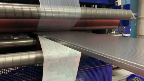 Application of protective films on plastic sheets at factory Stock Footage 237006393