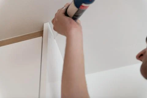 Application Silicone Installing Ceiling in House Stock Photos