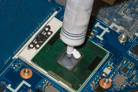Application of thermal paste to the microprocessor Stock Photos