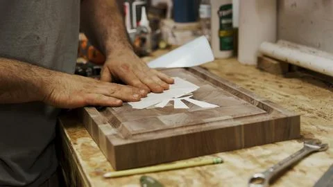 Application of white design elements on patterned wood surface Stock Photos