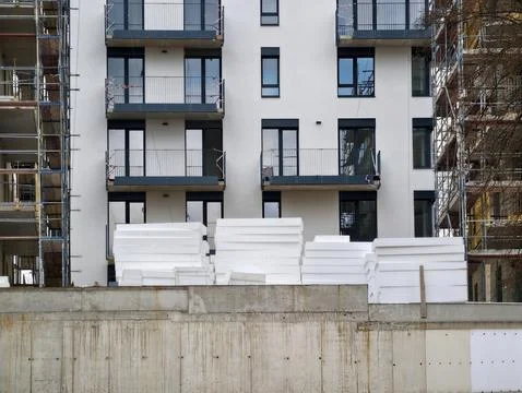 Application Of White Foam Panels On Pallets For Building Insulation With Pr.. Stock Photos