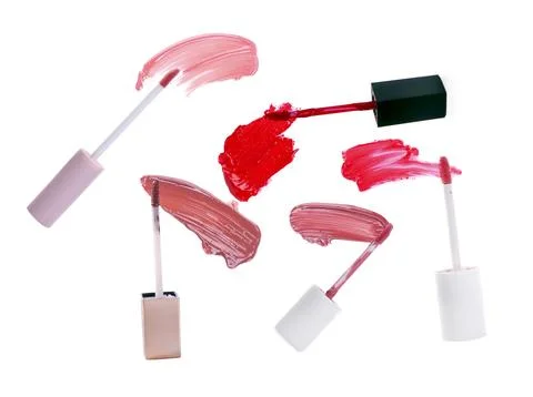 Applicators and lip gloss samples isolated on white Stock Photos