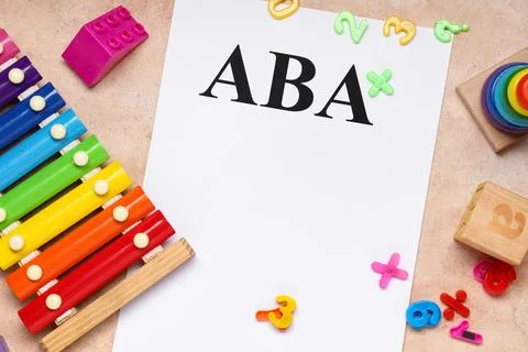 Applied behavior analysis ABA therapy with colorful educational toys and blan Stock Photos