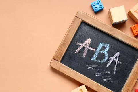 Applied behavior analysis (ABA) therapy concept on chalkboard with educationa Stock Photos