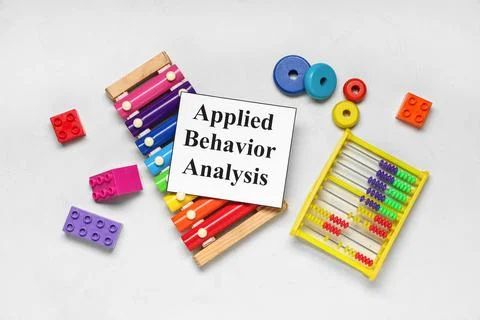 Applied behavior analysis with colorful educational toys xylophone abacus and Stock Photos