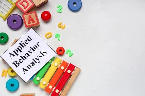 Applied behavior analysis with colorful educational toys and xylophone on whi Stock Photos