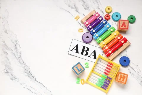 Applied behavior analysis with colorful educational toys xylophone abacus and Stock Photos