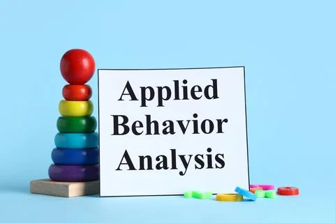 Applied behavior analysis with colorful stacking toy and educational card on  Stock Photos