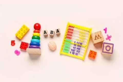 Applied behavior analysis therapy with colorful educational toys abacus and a Stock Photos