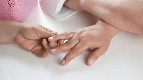 Applies the first color layer.Dries nails in a UV lamp with LEDs. Stock Footage 138813138