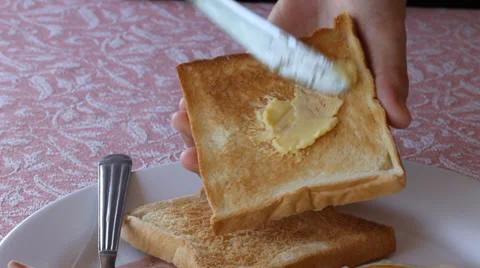 Apply butter bread Stock Footage 39863255