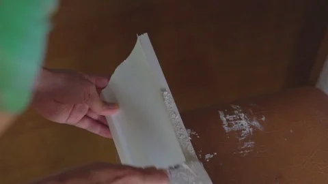 Apply glue to the skirting Board Stock Footage 116706658