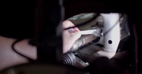 Apply grease to the steering gear.Maintenance by adding new grease. Stock Footage 306395993