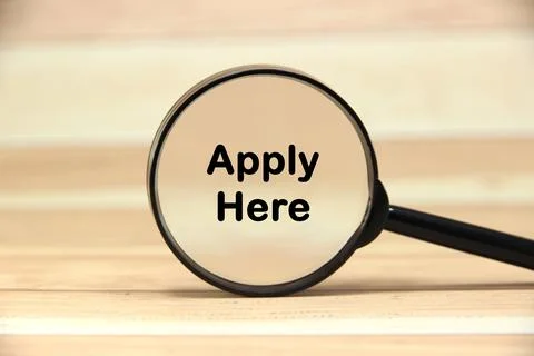 "Apply Here" text or message short word english letter on a on black magnif.. Stock Photos