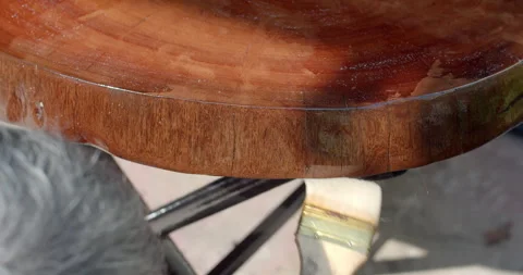 Apply a lacquer to coat the wood for durability and shine. Stock Footage 292424270