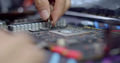 Apply new gray silicone to the RAM.The new silicone improves heat dissipation. Stock Footage 317757076