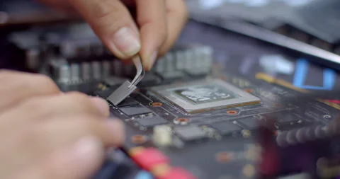 Apply new gray silicone to the RAM.The new silicone improves heat dissipation. Stock Footage 317757101