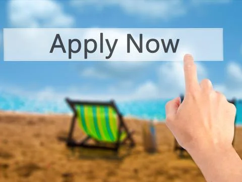 Apply Now - Hand pressing a button on blurred background concept on visual sc Stock Photos