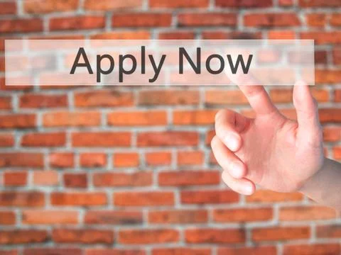 Apply Now - Hand pressing a button on blurred background concept on visual sc Stock Photos