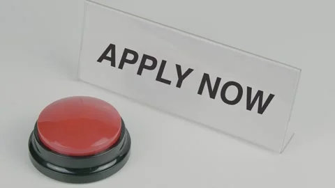 Apply Now text or word displayed on a nameplate as a hand presses  button Stock Footage 307189519