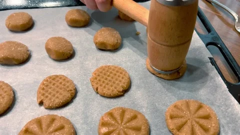Apply a pattern with a special tool on homemade cookies before baking them. Stock Footage 234191881