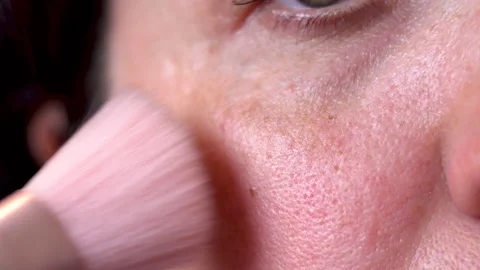 Apply powder to the face with a brush 4K Stock Footage 156530200