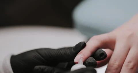 Apply remover to the cuticle. Manicure, nail care. Stock Footage 149366293