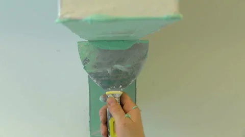 Applying and smoothing impregnation on plaster boards Stock Footage 55864953