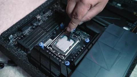 Applying and spreading thermal paste on CPU surface Stock Footage 324592446