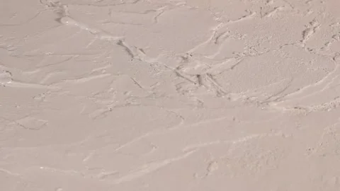 Applying an artistic white textured plaster with a small metal palette knife Stock Footage 135751416