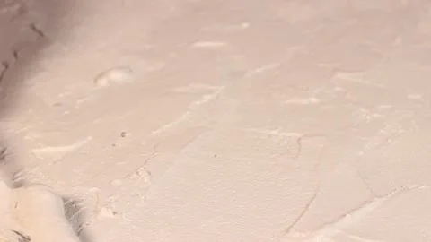 Applying an artistic white textured plaster with a small metal palette knife Stock Footage 135751705
