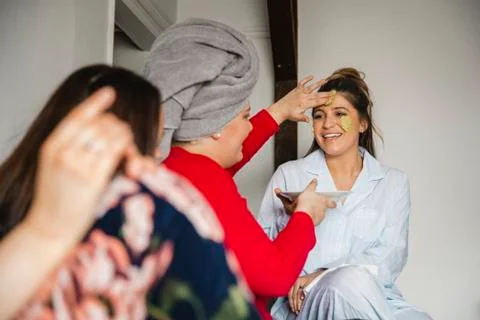 Applying an Avocado Mask Stock Photos