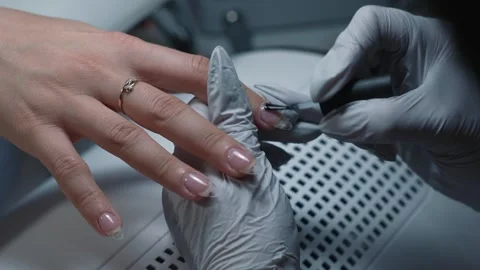 Applying base coat on extended nails before gel Stock Footage 343800763