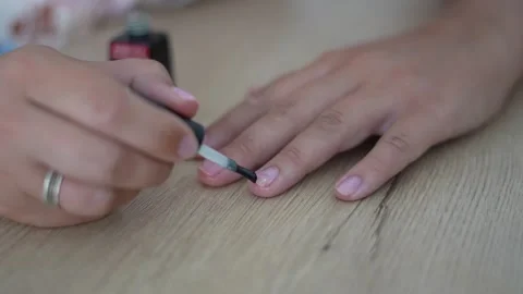 Applying Base Coat to Fingernails During Home Manicure Close Up Vídeos de archivo 341575428
