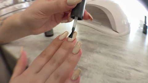 Applying Base Coat on Nails After Gel Polish Stock-Footage 315991865