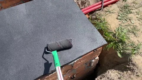 Applying bitumen mastic for waterproofing surface protection Видео 309043038