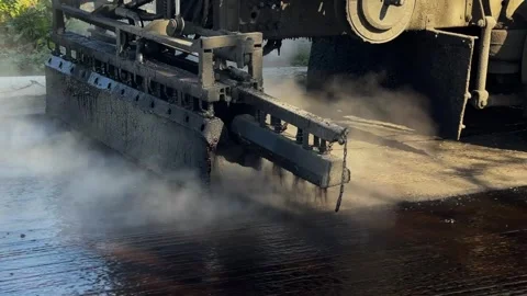 Applying bitumen to the pavement Stock-Footage 247268379